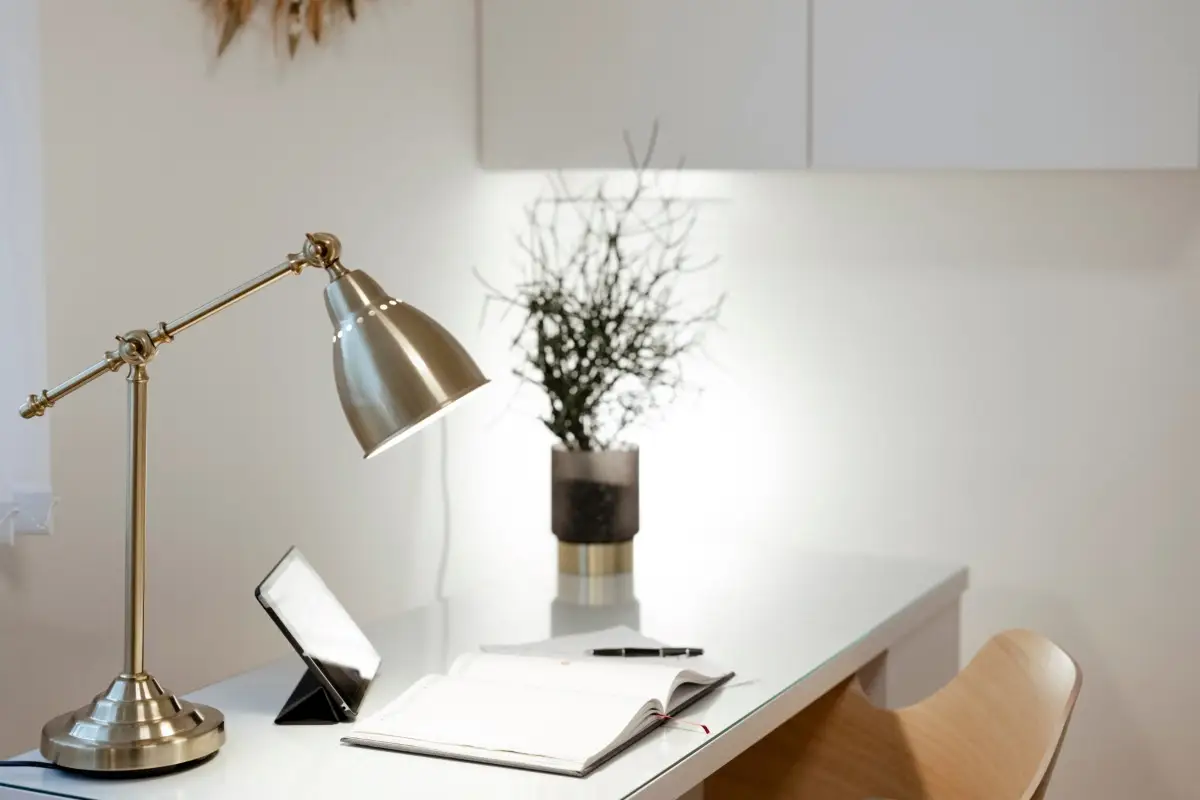 A well-organized home office demonstrating the feng shui commanding position, with the desk placed to face the room rather than a blank wall to promote opportunity.