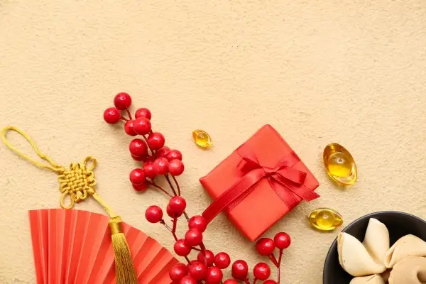 Small red and gold wrapped Chinese Christmas gifts.